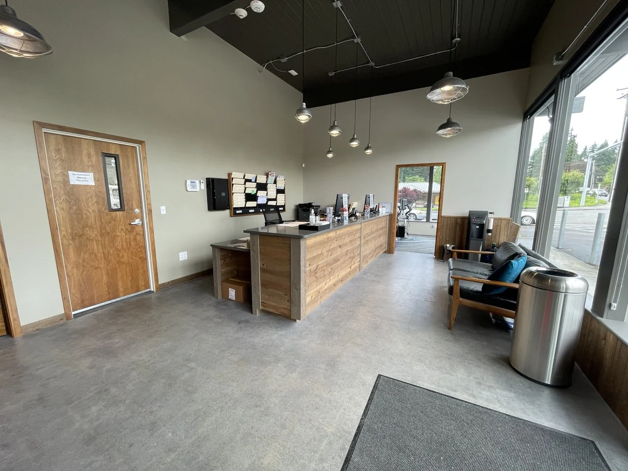 The front reception counter and seating area at Fleury’s Collision Center.