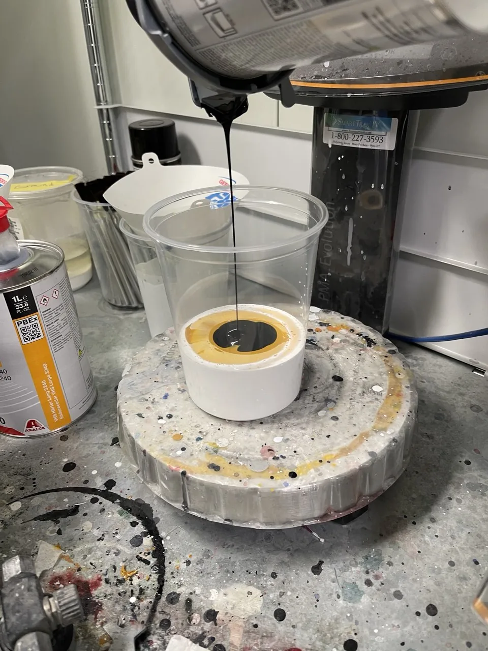 Paint container/mixing equipment close-up.